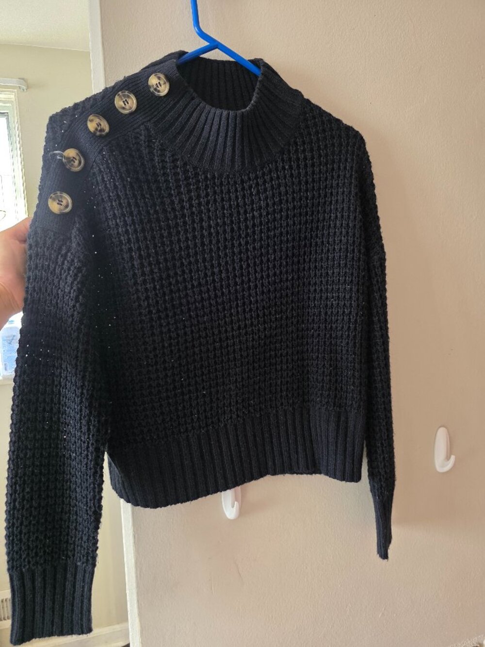 Navy blue sweater with shoulder bottons